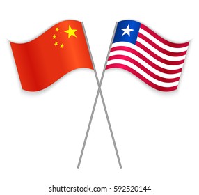 Chinese and Liberian crossed flags. China combined with Liberia isolated on white. Language learning, international business or travel concept.