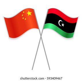 Chinese and Libyan crossed flags. China combined with Libya isolated on white. Language learning, international business or travel concept.