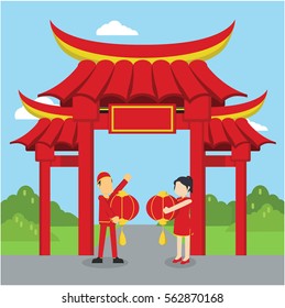 chinese man and chinese woman happy infront. of chinese gate