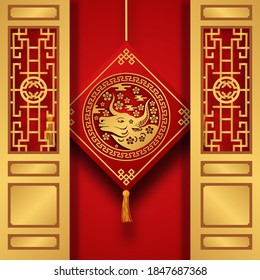 chinese new year 2021, ox year. hanging golden ox decoration with traditional gate door. happy lunar new year