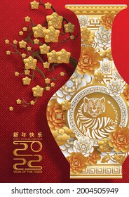 Chinese new year 2022 year of the tiger red and gold flower and asian elements paper cut with craft style on background.( translation : chinese new year 2022, year of tiger )