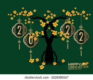 Chinese new year 2022 year of the tiger red and gold flower and asian elements paper cut with craft style on background.( translation : chinese new year 2022, year of tiger )