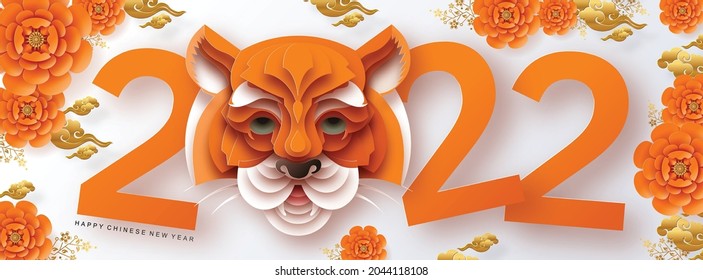 Chinese new year 2022 year of the tiger red and gold flower and asian elements paper cut with craft style on background.( translation : chinese new year 2022, year of tiger )