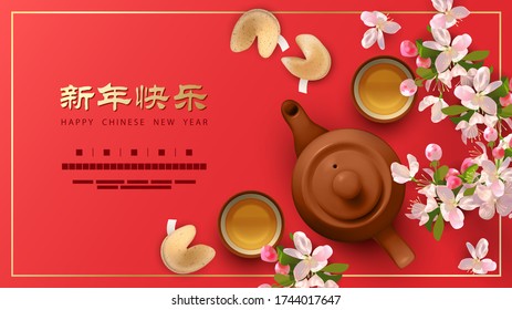 Chinese New Year concept. Teapot, tea cups, peach blossoms and fortune cookies with prediction. Chinese inscription means Happy New Year