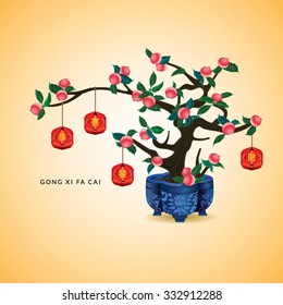 Chinese New Year Peach Tree. Hanging red packet with yellow chinese text "Gong Xi Fa Cai" means wishing you to be prosperous in the coming year.