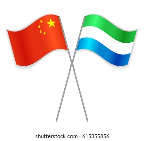 Chinese and Sierra Leonean crossed flags. China combined with Sierra Leone isolated on white. Language learning, international business or travel concept.