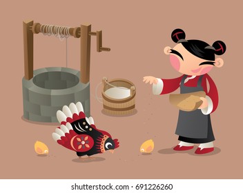 A Chinese village woman feeding chicken