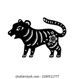 Chinese Zodiac New Year sign tiger. Traditional china horoscope animal. Silhouette of animal, painted in Chinese graphic style with floral ornate. Vector illustration. Paper cut
