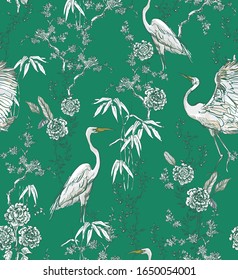 Chinoiserie Crane Birds in Floral Trees, Exotic Wallpaper Oriental Design, Chinese Blooming Garden White Flowers on Green Background Seamless Pattern