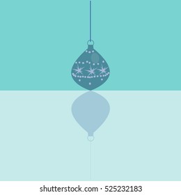 Chisrtmas ball on the blue background with reflection