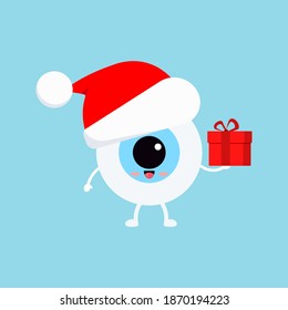 Chistmas eye ball with gift in red Santa Claus hat isolated on background. Ophthalmology holiday character - funny eyeball with present. Flat design cartoon style vector winter mascot illustration.