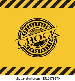 Chock black grunge emblem, yellow warning sign. Vector Illustration. Detailed.