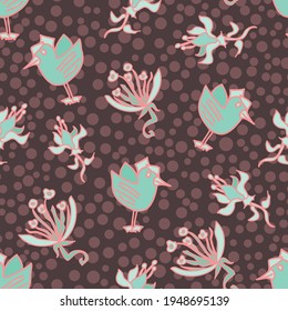Chocolate brown and mint green vector repeating pattern with birds and flowers on a dotted textured backdrop
