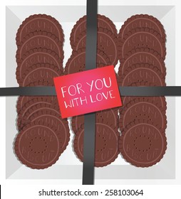 Chocolate cookies in a box with a note.
