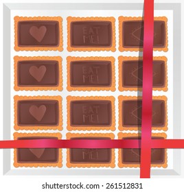 Chocolate cookies in a box with a note.
