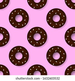 Chocolate donuts on a pink background. Seamless pattern. Vector illustration for poster
