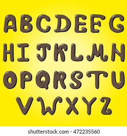 Chocolate letters on a yellow background. Chocolate alphabet.