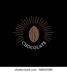 Chocolate logo, emblem, badge or label with cocoa bean. Vintage retro style. Isolated on black background. Vector illustration.