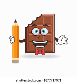 Chocolate mascot character holding a pencil. vector illustration