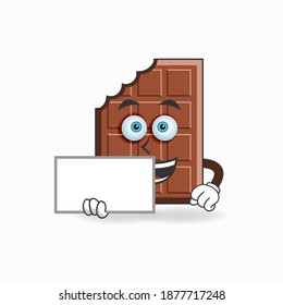 Chocolate mascot character holding a white blackboard. vector illustration