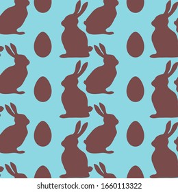 Chocolate rabbits and Easter eggs on blue background. Seamless pattern. Texture for fabric, wrapping, wallpaper. Decorative print. Vector illustration .