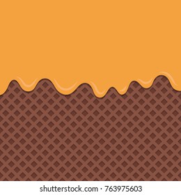 Chocolate wafer background with flowing orange sauce.