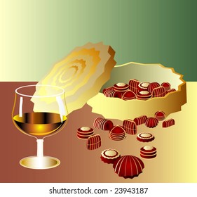 Chocolates in a beautiful golden box on a green
background and a glass of brandy