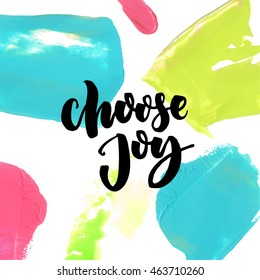 Choose joy saying at colorful paint background. Positive quote, vector brush lettering.