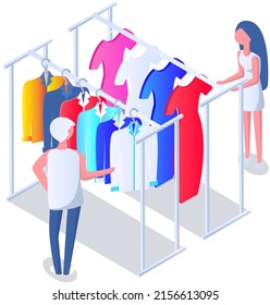 Choosing clothes in store with consultant. Shop assistant helps buyer to choose product during shopping. Customer service in mall. People stand near hangers with clothes in store or boutique