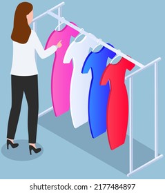 Choosing clothes in store, shopping concept. Female buyer chooses clothing in dressing room. Customer with dress hanging on hanger in mall. Woman shopper stands in fitting room of store or boutique