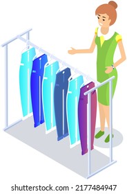 Choosing clothes in store, shopping concept. Female buyer chooses clothing in dressing room. Customer with dress hanging on hanger in mall. Woman shopper stands in fitting room of store or boutique