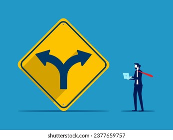 Choosing a life path. Businessman makes decision with two way intersection sign