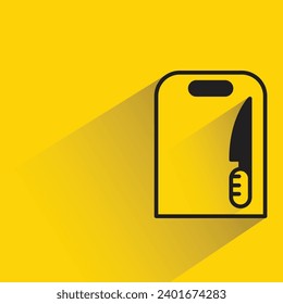 chopping board and knife icon with shadow on yellow background