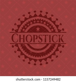 Chopstick badge with red background