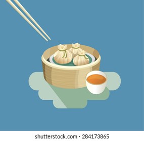 Chopsticks and Chinese traditional food - Dimsum Xiaolongbao and tea.