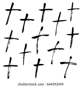 Christian cross painted by brush, isolated symbols set on a white background.