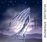 Christian Easter concept of three crosses on a hill and praying hands