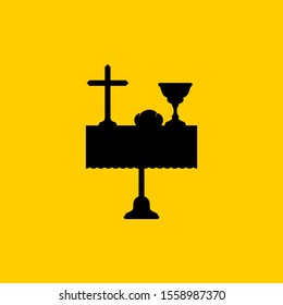 Christian symbols. A table with biblical symbols of the commandment of the sacrament - a cup of wine, bread and the cross of Jesus Christ. Communion in the church.
