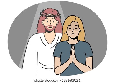 Christian woman prays to God with her palms together in prayer. Jesus Christ appeared to blonde girl in response to her request. Angel appeared in crisis moment, despair to give comfort, hope, love.