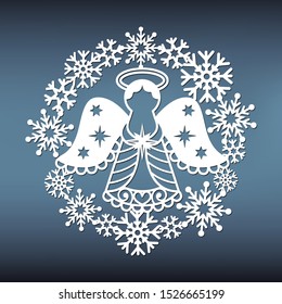 Christmas angel patterns in a snowy wreath for laser cutting. New year stencil for window decoration. Paper cut template for scrapbooking.Vector paper illustration.