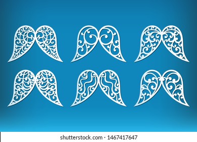 Christmas angel wings set isolated cutting templates with openwork pattern. Laser cut festive decoration with swirls in retro style, vector.