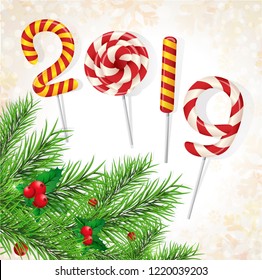 Christmas background 2019 of candy with snow and a Christmas tree