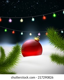 Christmas background with Christmas ball on the snow and garland
