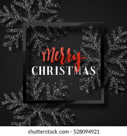 Christmas background, with beautiful bright snowflakes realistic shine glitter. In Framed calligraphy handmade. Merry Christmas poster, greeting card. Xmas decorations for the holidays