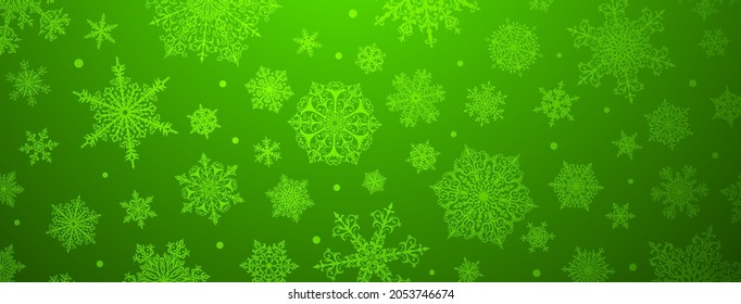 Weihnachtshintergrund für große und kleine komplexe Schneeflocken in grünen Farben