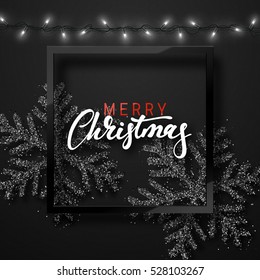 Christmas background black color with realistic garlands and beautiful snowflakes in the frame. Template christmas greeting card. Xmas Holiday and Happy New Year