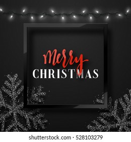 Christmas background black color with realistic garlands and beautiful snowflakes in the frame. Template christmas greeting card. Xmas Holiday and Happy New Year