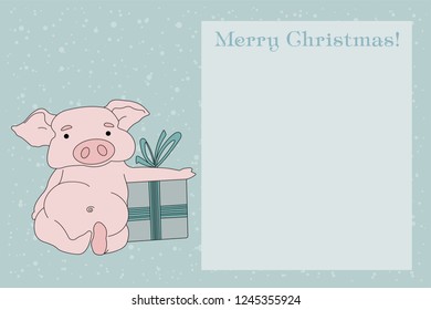 Christmas background with bokeh and greeting lettering. Against the background with bokeh Christmas pig in a red hat.
