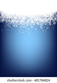Christmas background. Border made of fluffy snowflakes on soft blue background with space for text.