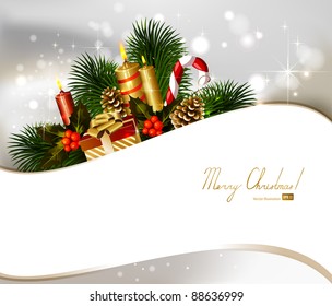 Christmas background with branch of fir tree with burning candles and Christmas bauble